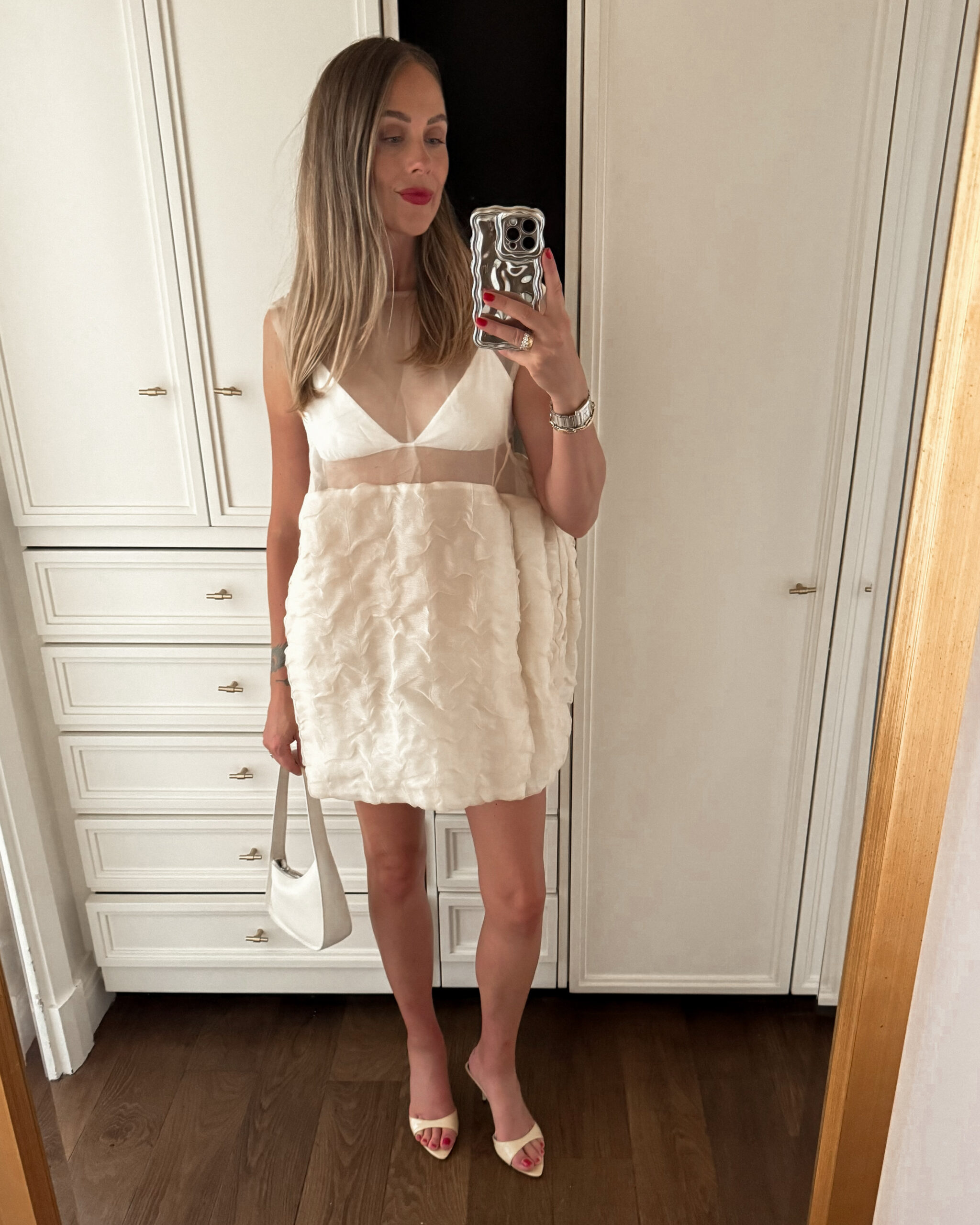 Fashion jackson Wearing Khaite Blair Linen-Silk Gauze Mini Dress Schutz Elodie Sandals The Row White Half Moon Handbag Paris Summer Outfit